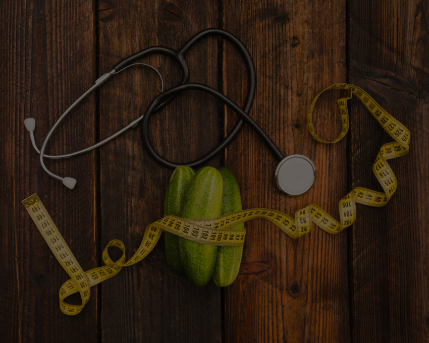 cucumbers-measuring-tape-stethoscope-wooden-surface-mod.jpg